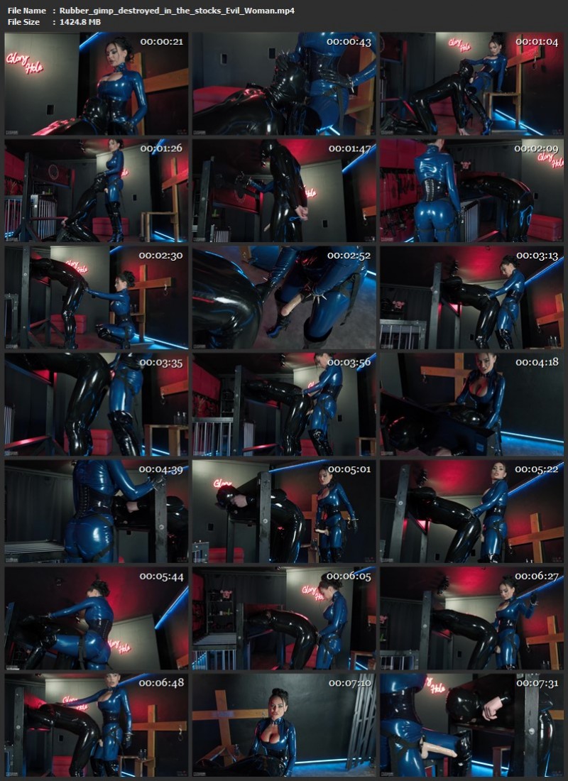 Rubber gimp destroyed in the stocks - Evil Woman. (1424 Mb)